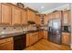 Gourmet kitchen featuring high-end appliances, granite countertops, custom cabinetry, and a functional layout at 11715 Dancliff Trce, Alpharetta, GA 30009