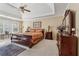 Inviting main bedroom featuring a trey ceiling, sitting area, and large windows that flood the room with light at 11715 Dancliff Trce, Alpharetta, GA 30009