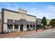 Street view of Smokejack restaurant and neighboring retail, featuring outdoor seating and brick sidewalk at 11715 Dancliff Trce, Alpharetta, GA 30009