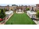 Town center with a large green space, shops, and buildings in the background, perfect for community events at 11715 Dancliff Trce, Alpharetta, GA 30009