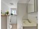 Bathroom features tile flooring, a large vanity, decorative lighting, and natural lighting at 1405 Bramlett Forest Trl, Lawrenceville, GA 30045