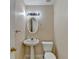 Charming half bath features a pedestal sink and classic fixtures at 1405 Bramlett Forest Trl, Lawrenceville, GA 30045