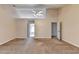 Large primary bedroom featuring a vaulted ceiling, fan, and neutral carpet at 1405 Bramlett Forest Trl, Lawrenceville, GA 30045
