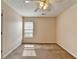 Bright bedroom featuring neutral walls, carpet flooring and ceiling fan with light kit at 1405 Bramlett Forest Trl, Lawrenceville, GA 30045