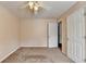 Bedroom features plush carpet, neutral walls, ceiling fan, window and access to closet at 1405 Bramlett Forest Trl, Lawrenceville, GA 30045