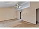 Large primary bedroom featuring a vaulted ceiling, fan, and neutral carpet at 1405 Bramlett Forest Trl, Lawrenceville, GA 30045