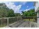 Wooden deck showcasing a serene outdoor view, creating a perfect spot for relaxation and enjoying nature at 1405 Bramlett Forest Trl, Lawrenceville, GA 30045