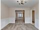 Open dining room with view to living room with bay windows and fireplace creating a great flow at 1405 Bramlett Forest Trl, Lawrenceville, GA 30045