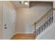 Inviting entryway features hardwood floors, staircase, and neutral paint, creating a bright and welcoming space at 1405 Bramlett Forest Trl, Lawrenceville, GA 30045