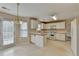 Cozy eat-in kitchen featuring white cabinetry and stainless steel appliances at 1405 Bramlett Forest Trl, Lawrenceville, GA 30045