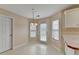 Light-filled breakfast nook area with backyard access and ample natural light at 1405 Bramlett Forest Trl, Lawrenceville, GA 30045