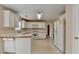Bright kitchen with white cabinets, wood counters, and modern appliances at 1405 Bramlett Forest Trl, Lawrenceville, GA 30045