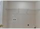 Utility room includes convenient washer and dryer hookups with wire shelving at 1405 Bramlett Forest Trl, Lawrenceville, GA 30045