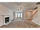 Open living room with fireplace and hardwood flooring, offering access to entryway, and window bay area at 1405 Bramlett Forest Trl, Lawrenceville, GA 30045