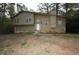 Two-story home with stone foundation and light green exterior at 185 Windhaven Sw Trl, Atlanta, GA 30331