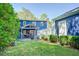 Beautiful backyard with covered patio, manicured lawn, offering a serene outdoor space at 2195 Edison Ne Ave, Atlanta, GA 30305