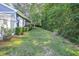 Lush backyard featuring well-maintained lawn, mature plantings, and a serene landscape at 2195 Edison Ne Ave, Atlanta, GA 30305