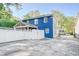 Backyard view of blue house with white fence and patio at 2195 Edison Ne Ave, Atlanta, GA 30305