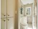 Bathroom featuring a tile shower, toilet, and sink at 2195 Edison Ne Ave, Atlanta, GA 30305