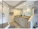 Bathroom features a glass-enclosed shower, double vanity, and a large mirror at 2195 Edison Ne Ave, Atlanta, GA 30305