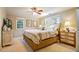 Comfortable bedroom with a large bed, dresser, and natural light from the windows at 2195 Edison Ne Ave, Atlanta, GA 30305