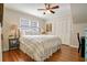 Comfortable bedroom with hardwood floors, a queen-size bed, and a ceiling fan at 2195 Edison Ne Ave, Atlanta, GA 30305