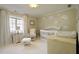 Cozy Bedroom with neutral tones, featuring a crib, glider, and soft natural light at 2195 Edison Ne Ave, Atlanta, GA 30305
