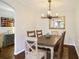 Dining room featuring a wooden table, chandelier, and view into an adjacent living space at 2195 Edison Ne Ave, Atlanta, GA 30305