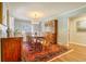 Elegant dining room with hardwood floors, a large table, and a decorative rug at 2195 Edison Ne Ave, Atlanta, GA 30305
