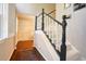 Inviting entryway with hardwood floors, carpeted stairs, and natural light from the window at 2195 Edison Ne Ave, Atlanta, GA 30305