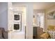 Efficient laundry area with stacked washer and dryer, and stylish checkered tile floor at 2195 Edison Ne Ave, Atlanta, GA 30305