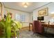 Cozy home office with a wooden desk, comfortable chair, and patterned wallpaper at 2195 Edison Ne Ave, Atlanta, GA 30305