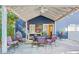 Charming covered patio with overhead lighting, dining set, and inviting atmosphere for outdoor gatherings at 2195 Edison Ne Ave, Atlanta, GA 30305