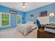 Bright bedroom featuring two windows, white trim, blue walls, desk and ceiling fan at 2329 Marion Walk Se Dr # 5, Atlanta, GA 30339