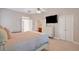 Spacious bedroom with plush carpet, walk-in closet, and ensuite bathroom at 2329 Marion Walk Se Dr # 5, Atlanta, GA 30339