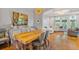 Dining room adjacent to living room featuring modern table and hardwood floors at 2329 Marion Walk Se Dr # 5, Atlanta, GA 30339