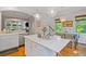 Bright, open kitchen featuring a large island with marble countertops and pendant lighting at 2329 Marion Walk Se Dr # 5, Atlanta, GA 30339