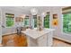 Stylish kitchen with a marble island, hardwood floors, and natural light from the windows at 2329 Marion Walk Se Dr # 5, Atlanta, GA 30339