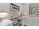 Modern kitchen includes stainless steel appliances, white cabinetry, and a tile backsplash at 2329 Marion Walk Se Dr # 5, Atlanta, GA 30339
