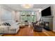 Bright living room featuring a fireplace, coffered ceilings, and large windows at 2329 Marion Walk Se Dr # 5, Atlanta, GA 30339