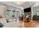 Bright living room featuring a fireplace, coffered ceilings, and large windows at 2329 Marion Walk Se Dr # 5, Atlanta, GA 30339
