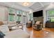 Spacious living room with fireplace, coffered ceiling, and large windows overlooking backyard at 2329 Marion Walk Se Dr # 5, Atlanta, GA 30339