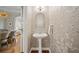 Charming powder room with pedestal sink and decorative wallpaper at 2329 Marion Walk Se Dr # 5, Atlanta, GA 30339