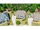 Expansive property featuring a well-manicured lawn, mature trees, and a long driveway at 621 Oakbourne Way, Woodstock, GA 30188