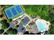Bird's-eye view of community amenities including tennis courts, pool, and parking area amidst trees at 621 Oakbourne Way, Woodstock, GA 30188
