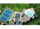 Overhead shot of the community featuring tennis courts, parking, swimming pool, and playground at 621 Oakbourne Way, Woodstock, GA 30188