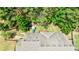 Aerial view of a backyard with a swing set, play area and wooded surround at 621 Oakbourne Way, Woodstock, GA 30188