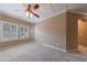 Bedroom featuring two windows with white shutters and neutral colored walls at 621 Oakbourne Way, Woodstock, GA 30188