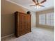 Bedroom featuring a large wardrobe and two windows with white shutters at 621 Oakbourne Way, Woodstock, GA 30188