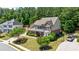 Beautiful home with mature trees, green grass, and a basketball hoop at 621 Oakbourne Way, Woodstock, GA 30188